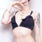 This ruffle bra accentuates Natasha Lillipore's bust